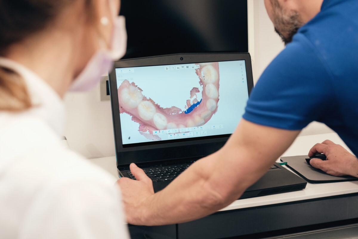 Kelowna dentist reviewing dental crown scans